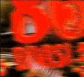 a blurry picture of a person 's face with the word coca cola on it