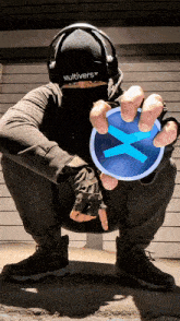 a man wearing headphones and a multiverse beanie
