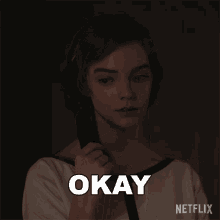 a netflix ad shows a woman holding a black object in her hand