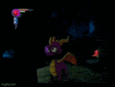 a purple dragon is standing in a dark room with a green light coming out of its chest .