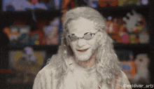 a man with white paint on his face and glasses has the hashtag @meldivar_arts on the bottom right