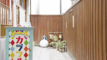 a wooden fence with a colorful sign that says ' a ' on it