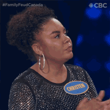 a woman wearing a name tag that says christen