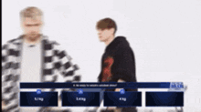 two men are standing next to each other in front of a screen that says ' a be ready to answer '