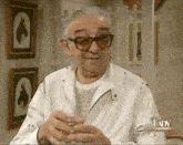 an elderly man is holding a glass of wine and is on lady channel