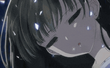a close up of a girl with her eyes closed