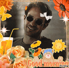 a man wearing sunglasses is surrounded by flowers and a teddy bear that says " good morning "
