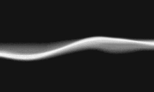 a white wave on a black background that looks like smoke coming out of a pipe .