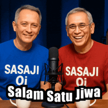 two men wearing sasaji oi shirts sit in front of microphones