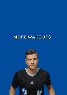 a man is holding a sign that says more wake ups