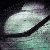 a green and purple image of a person 's feet