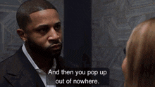 a woman in a red jacket is talking to a man with the words " and then you pop up out of nowhere " next to her