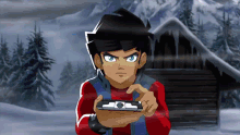 a boy in a red shirt is holding a device in his hand