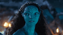 a picture of a woman with a blue face is from avatar