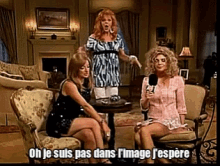 a woman holding a microphone says oh je suis pas dans l ' image j'espere