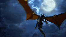 a dragon is flying through a dark blue sky with a full moon behind it .