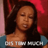 a woman is making a funny face and saying `` dis tew much '' with her eyes closed .