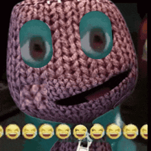 a close up of a stuffed animal with smiley faces on it 's face