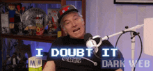 a man is sitting in front of a microphone with the words i doubt it dark web on the screen