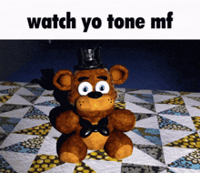 a teddy bear wearing a top hat and bow tie sits on a quilt with the words watch yo tone mf below it