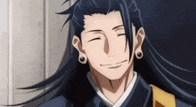 a man with long black hair is smiling with his eyes closed .