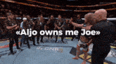 a group of men standing in a boxing ring with the words aljo owns me joe