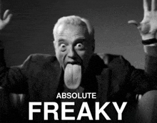 a black and white photo of a man sticking his tongue out with the words absolute freaky below him
