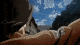 a man is laying down in front of a building with a sword coming out of his chest .