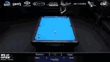 a pool table with a blue cloth and two men playing pool
