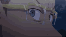 a close up of a person wearing glasses with their eyes wide open