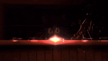 a cartoon cat is holding a light bulb that says ' 00 ' on it