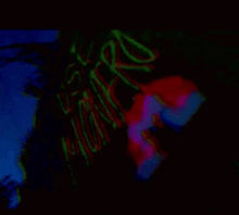 a glow in the dark image of a person 's face with the word monster written on the back