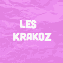 a purple background with the words les krakoz written on it