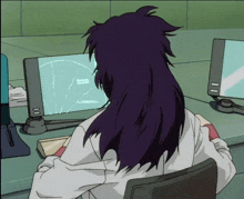 a person with purple hair is sitting in front of a computer monitor with a circle on it that says ' a '