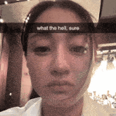 a woman with a bandage on her face has the words what the hell sure above her face