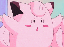 a close up of a pink cartoon character with a surprised look on his face