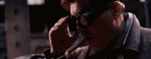 a man is smoking a cigar with a fork in his hand .