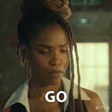 a woman with dreadlocks says go in a netflix advertisement