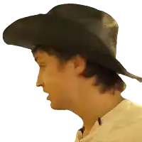 a man wearing a cowboy hat is looking to the side