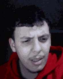 a close up of a man 's face with his eyes closed