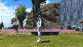 a person standing in front of a waterfall with purple flowers