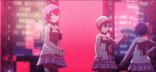 three anime girls are standing next to each other on a stage in front of a pink background .