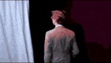 a pixelated image of a man in a suit