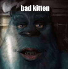 a painting of a monster with the words `` bad kitten '' on it .