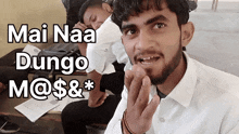 a man with the words mai naa dungo m @ $ & * written on his face
