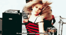 a woman in a red and black striped dress says " he wasn 't what i wanted "