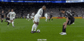 a soccer player with the number 8 on his jersey is kicking a ball