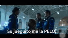 a group of men standing next to each other with the words su jueguito me la pelo written on the bottom