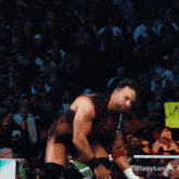 a man in a wrestling ring with a sign that says austin erna