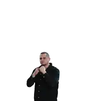 a man in a black shirt holds his arms up in the air